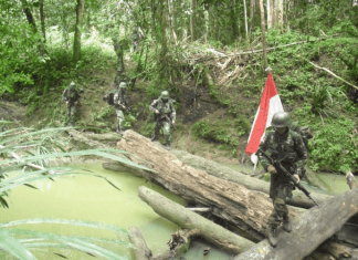 Galeri Foto Patroli TNI di Perbatasan Papua Galeri Foto Patroli TNI di Perbatasan Papua