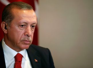Erdogan Cela AS Karena Kirim Perlengkapan Militer Kepada Militan Kurdistan Suriah Turkish President Tayyip Erdogan prepares for an interview in New York