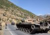 Ditentang Baghdad, Turki Bersikeras Tempatkan Tentaranya di Irak Turkish soldiers in a tank and an armored vehicle patrol on the road to the town of Beytussebab in the southeastern Sirnak province, Turkey