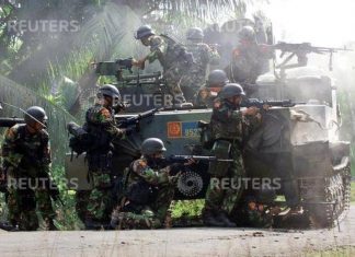 Foto Foto Darurat Militer Aceh 2003-2004, Operasi Militer Lawan GAM TNI melayani kontak tembak dengan Gerakan Aceh Merdeka, 2003